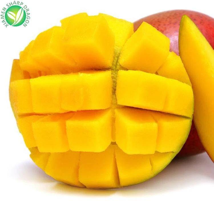 Ripe mango cheek cut into cubes beside a whole mango