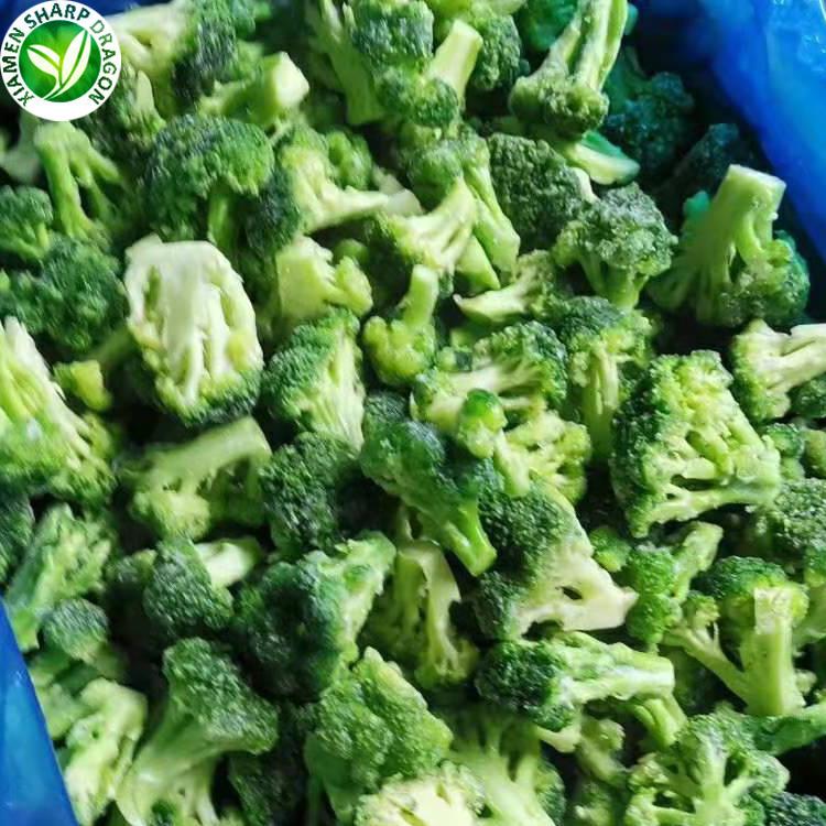 Frozen broccoli florets with green crowns and pale cut stems