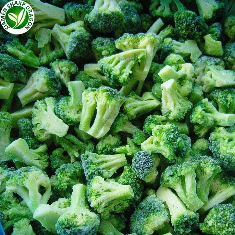 Loose frozen broccoli florets and short stems with visible frost