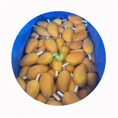 Whole frozen mango pieces in a bulk handling container Whole frozen mango pieces held in a lined processing bin