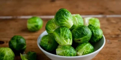 Whole Brussels sprouts showing size and form Whole Brussels sprouts in a bowl for visual size comparison