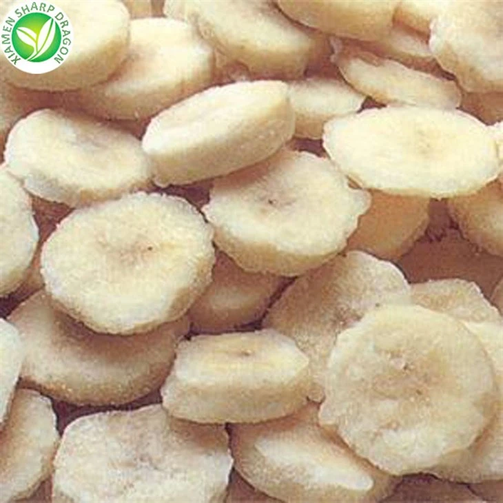 Frozen banana rounds showing surface frost and cut consistency Frosted round banana slices in a loose frozen condition