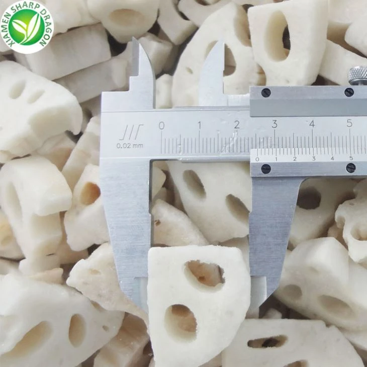 Frozen lotus root pieces showing cut and frost condition