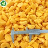 Frozen Orange Piece Size Check Frozen orange pieces checked against a ruler for size consistency