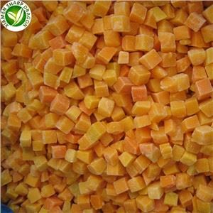 Uniform pumpkin dice for a controlled edible serving Small orange frozen pumpkin dice with visible frost