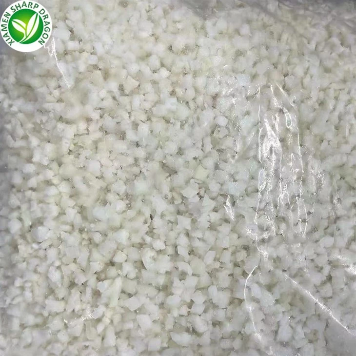 Chopped Size of Frozen Cauliflower Rice Frozen cauliflower rice particles showing chopped size and white color